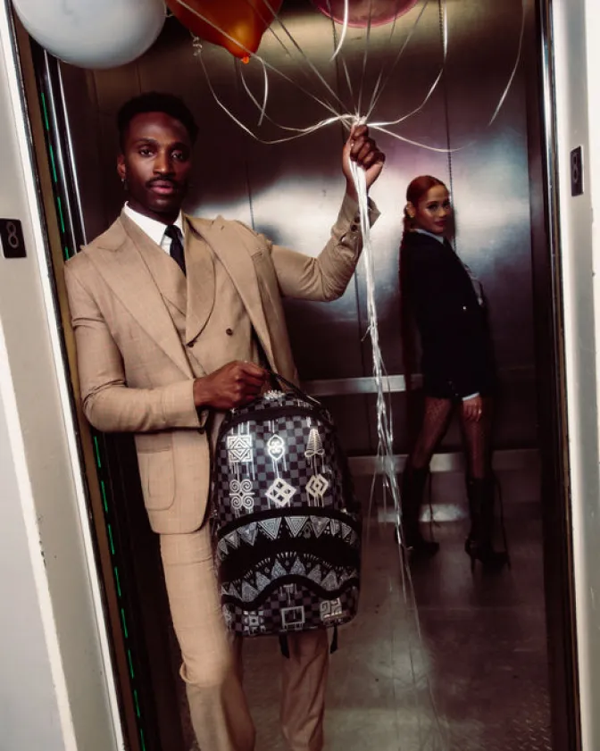 AFRICAN INTELLIGENCE 9 POWER GLYPHICS BACKPACK - SANDFLOWER COLLAB